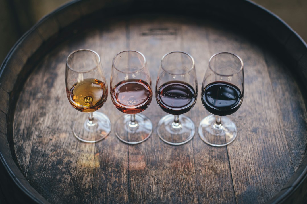 Four wine glasses on a barrel, illustrative stock photograph; not La Oficina’s event
