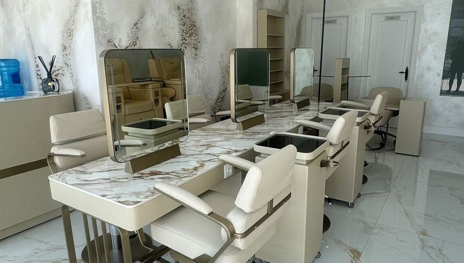 Cream styling chairs and marble-effect stations at The Perfect Place for Face